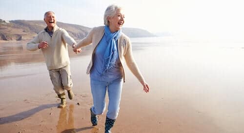 Happy senior couple on the beach