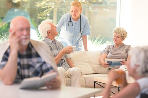 A group of seniors enjoy their long term care facility