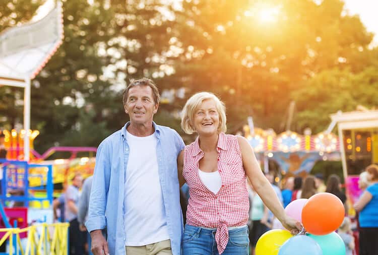 A senior couple enjoys a Florida fall festival