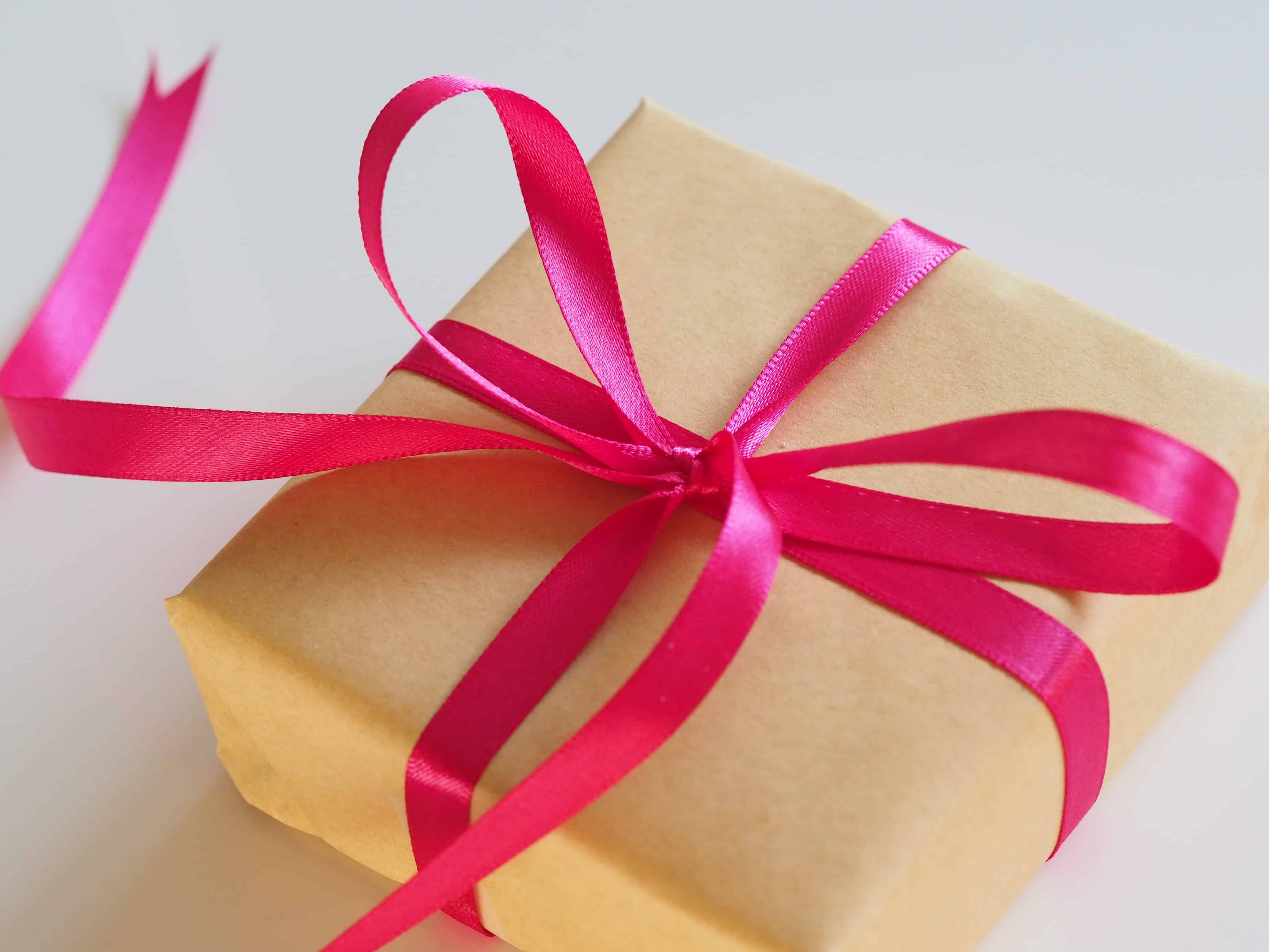 Pink ribbon tied in a bow on a present