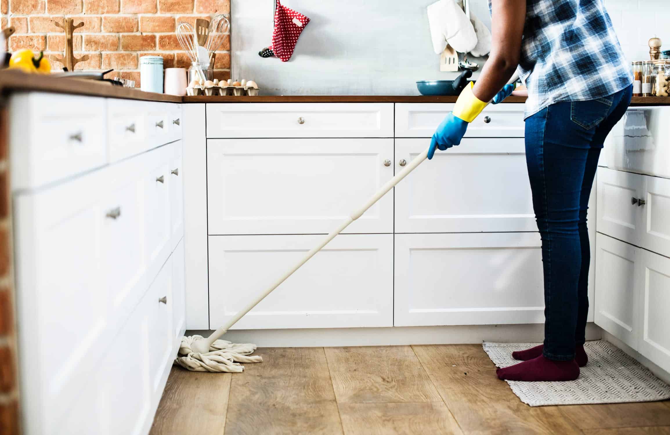 Woman mopping the kitchen floor