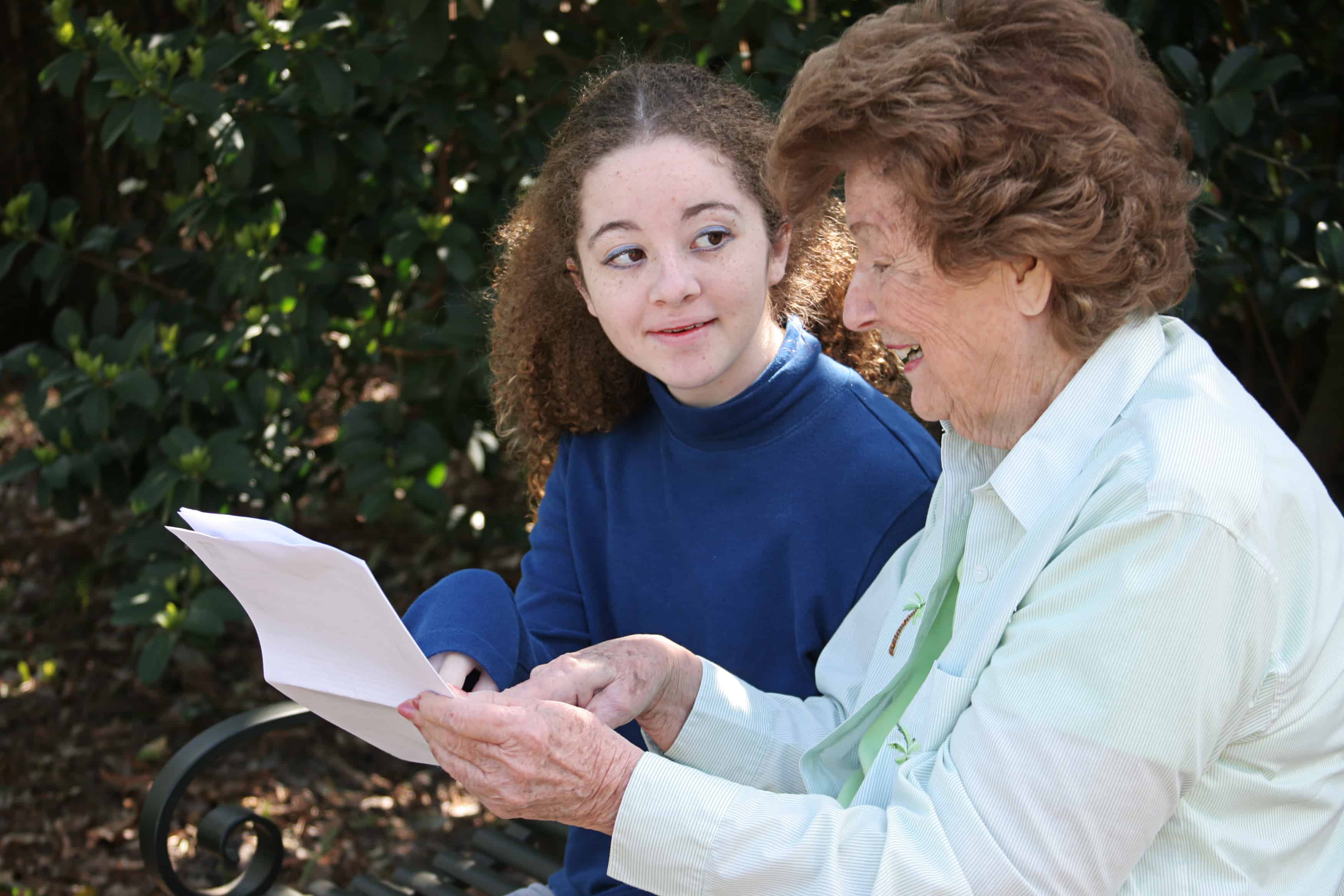 A senior living resident working as an adult mentor with a Suwannee County freshman
