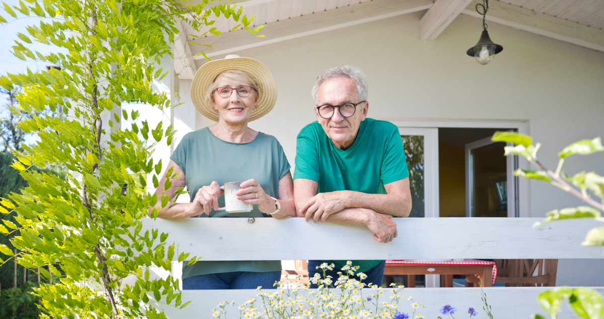 Senior couple standing on porch